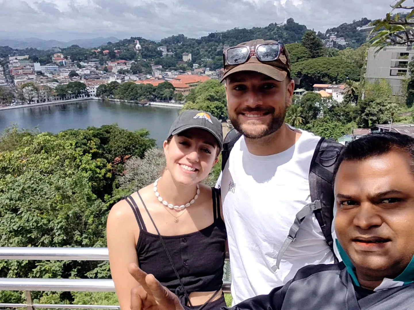 Thilak with guests near a Kandy lake viewpoint